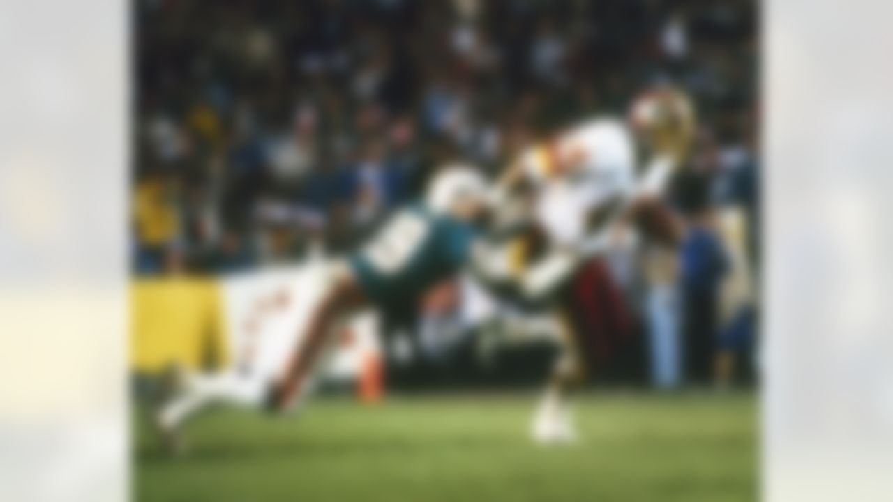 Washington Redskins running back John Riggins drags Miami Dolphins defensive back Don McNeal in the Redskins 27-17 victory in Super Bowl XVII on January 30, 1983 at the Rose Bowl in Pasadena, California. (AP Photo/Al Messerschmidt)