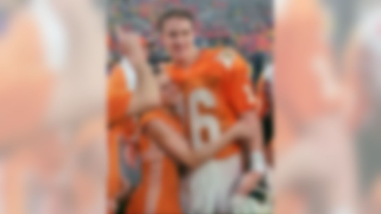 Tennessee quarterback Peyton Manning (16) is congratulated by an unidentified cheerleader after Tennessee defeated Ohio State 20-14 to win the Citrus Bowl Monday, January 1, 1996, in Orlando. (AP Photo/Chris O'Meara)
