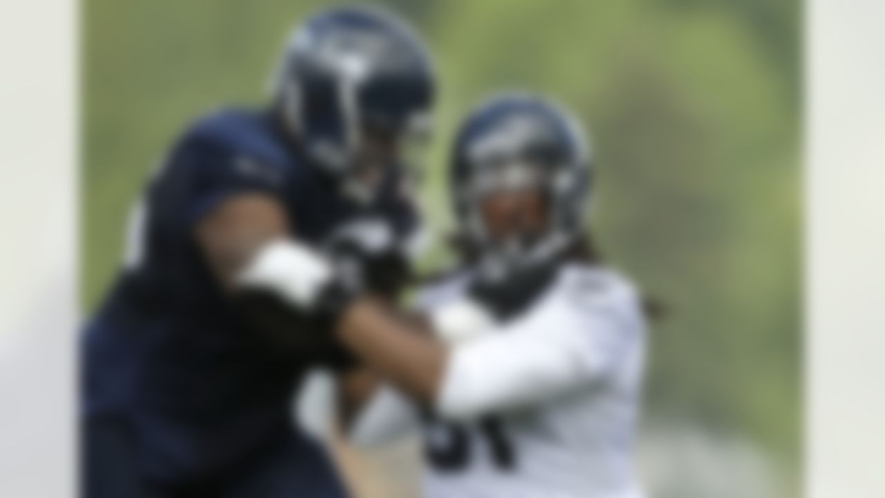 Seattle Seahawks defensive end Bruce Irvin, right, is blocked by tackle Frank Omiyale, Saturday, July 28, 2012, on the first day of Seattle Seahawks NFL football training camp. (AP Photo/Ted S. Warren)