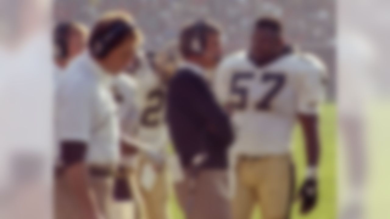 Saints Head Coach Jim Mora talks to linebacker Rickey Jackson (57) during a matchup between the San Francisco 49ers and New Orleans Saints at Candlestick Park Sunday, December 11, 1988. 49ers beat Saints 30-17. (AP Photo/Al Golub)