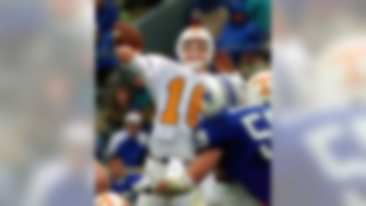 Tennessee quarterback Peyton Manning launches a pass during the second half of his team's 59-31 win over Kentucky Saturday, Nov. 22, 1997, in Lexington, Ky. Manning threw for 523 yards on 25 of 35 passing with five touchdowns. (AP Photo/Ed Reinke)