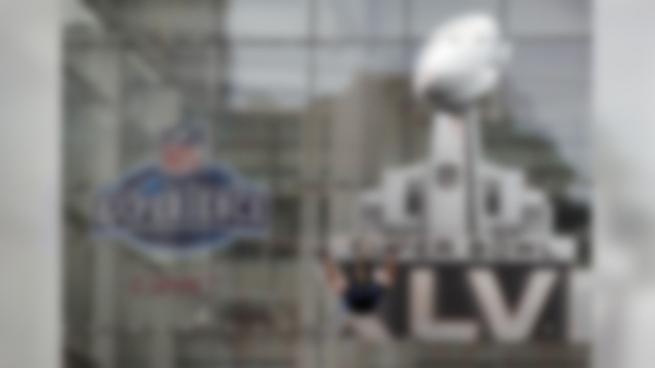 A fan rides a zip line as part of festivities for NFL football's Super Bowl XLVI Tuesday, Jan. 31, 2012, in Indianapolis. (AP Photo/Michael Conroy)