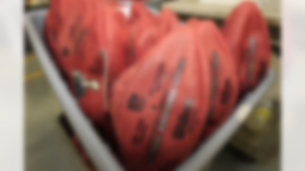 Unfinished official game balls for NFL football Super Bowl XLVI rest in a bin at Wilson Sporting Goods Co., in Ada, Ohio, Monday, Jan. 23, 2012. The New England Patriots will play the New York Giants in the Super Bowl on Feb. 5 in Indianapolis. (AP Photo/Tony Dejak)