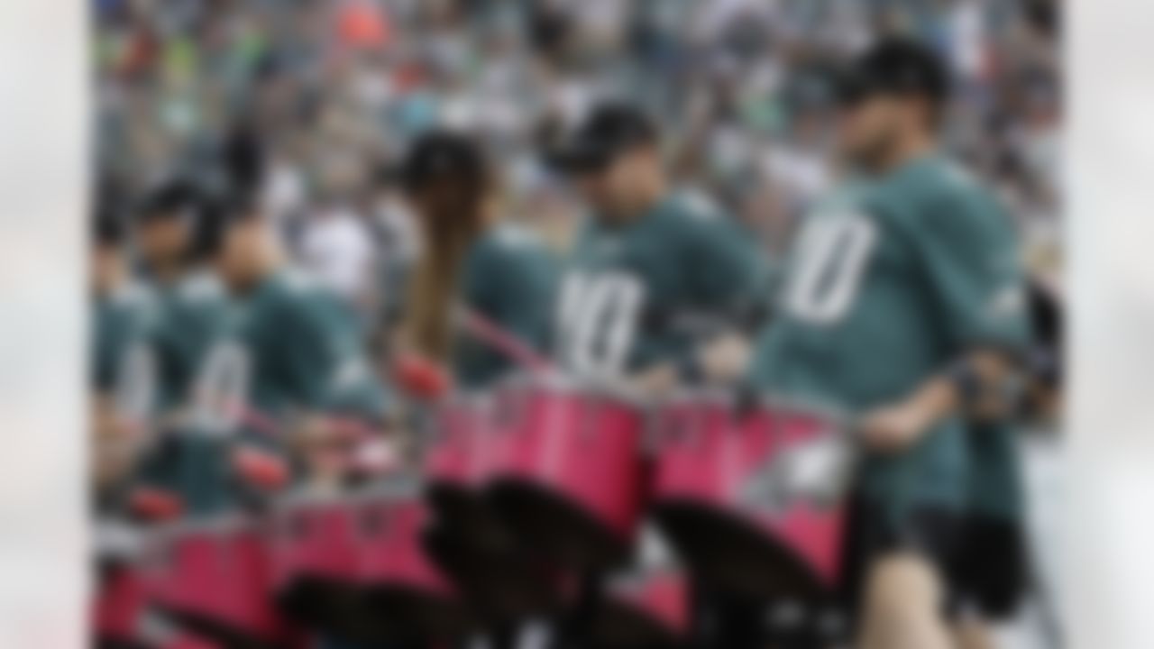 A Philadelphia Eagles pep group performs before an NFL football game against the Arizona Cardinals, Sunday, Oct. 8, 2017, in Philadelphia.