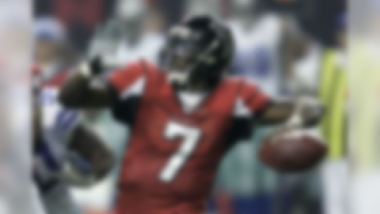 Atlanta Falcons' Michael Vick throws a pass against the Dallas Cowboys during the first half of an NFL football game Saturday, Dec. 16, 2006, in Atlanta. (AP Photo/Rob Carr)