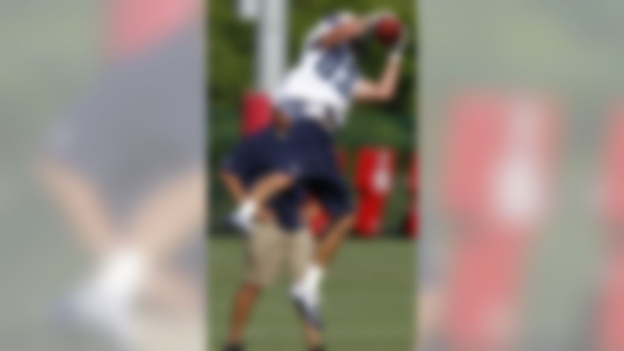 Tennessee Titan receiver Marc Mariani leaps for a pass during NFL football training camp on Saturday, July 28, 2012, Nashville, Tenn. (AP Photo/Wade Payne)