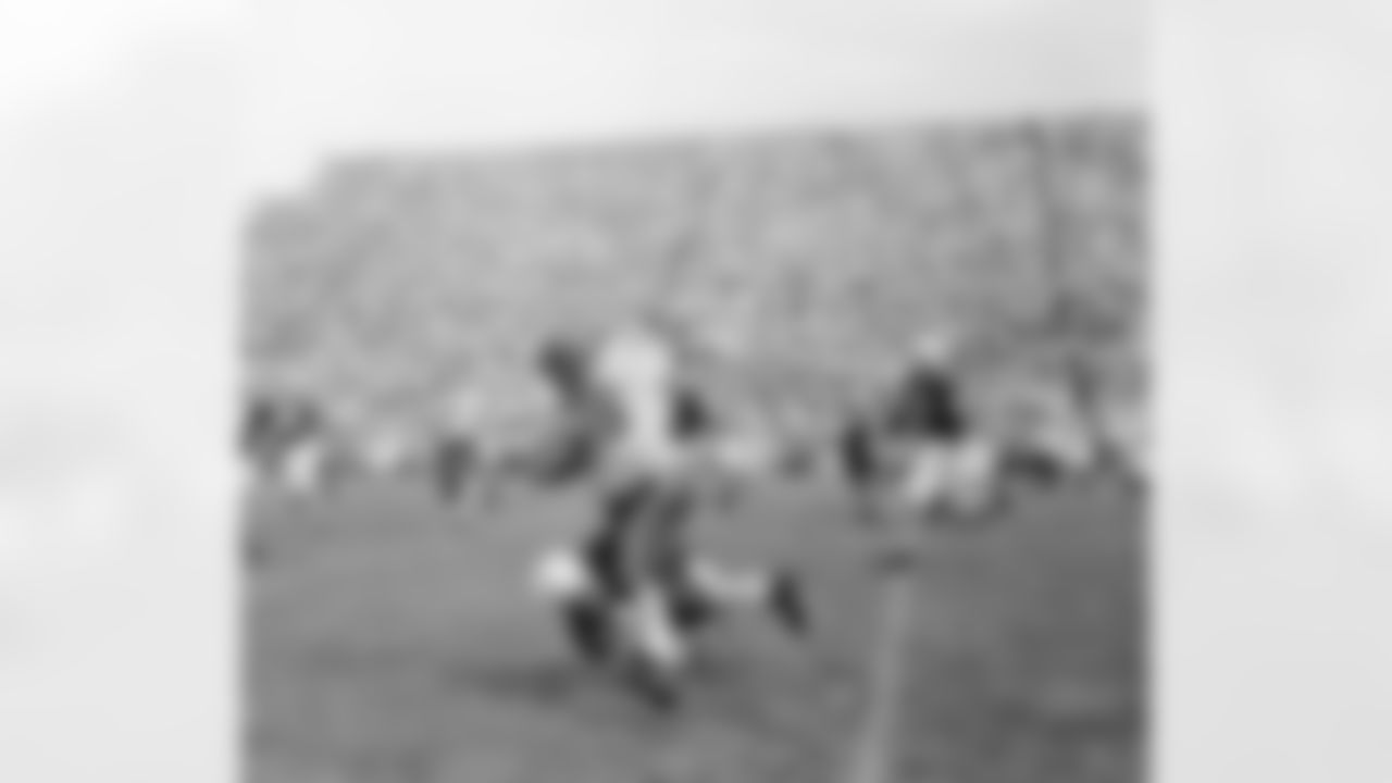Wisconsin full back Alan Ameche (35) carries the ball for 15 yards against Michigan State in East Lansing, Mich., Oct. 2, 1954. (Associated Press)