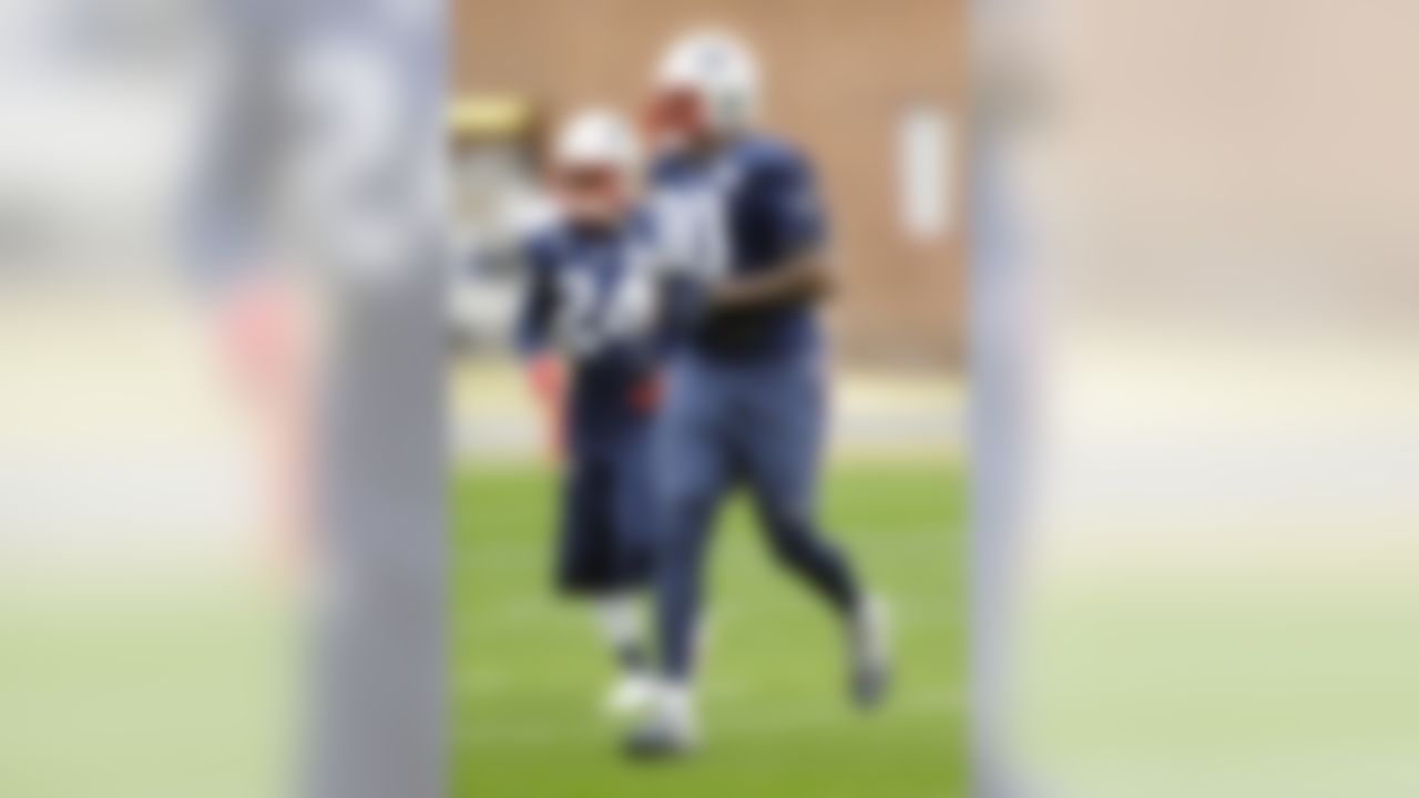 New England Patriots defensive end Zach Moore (90) and cornerback Darrelle Revis (24) warm up during practice Friday, Jan. 30, 2015, in Tempe, Ariz. The Patriots play the Seattle Seahawks in NFL football Super Bowl XLIX Sunday, Feb. 1. (AP Photo/Mark Humphrey)