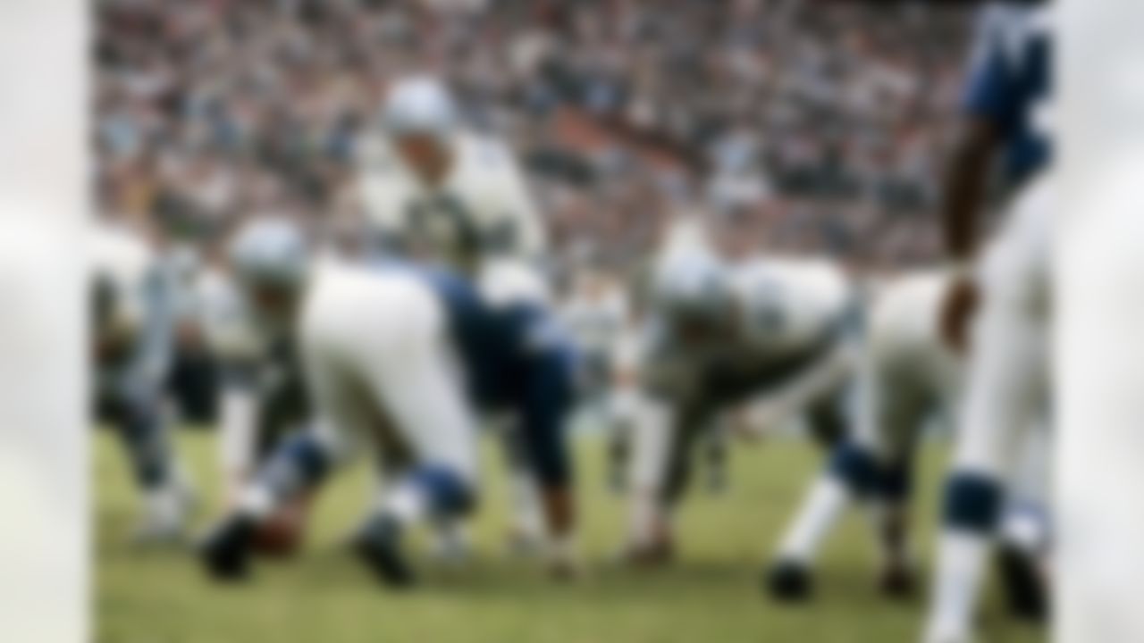Dallas quarterback Don Meredith (17) under center Dave Manders (51) during the Cowboys 35-3 loss to the Baltimore Colts in the Playoff Bowl on January 9, 1966 at the Orange Bowl in Miami Florida. 1966 NFL Playoff Bowl - Baltimore Colts vs Dallas Cowboys - January 9, 1966 (NFL Photos)