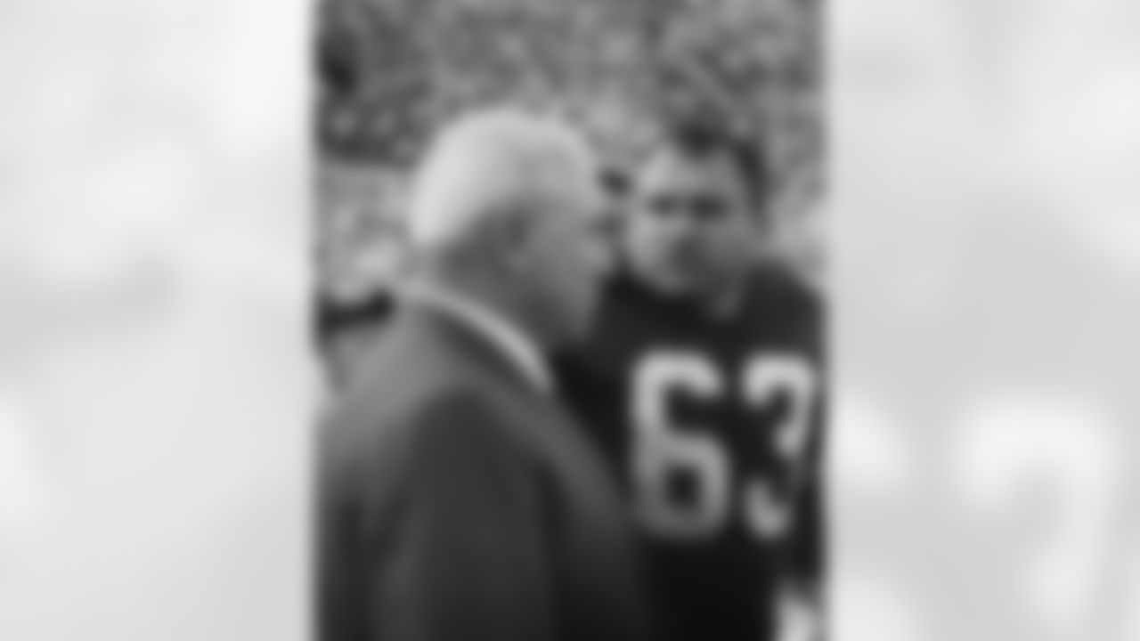 Green Bay Packers guard Fuzzy Thurston (63) talks with former Packer and member of the Pro Football Hall of Fame Tony Canadeo during Super Bowl I, a 35-10 victory over the Kansas City Chiefs on January 15, 1967, at the Los Angeles Memorial Coliseum in Los Super Bowl I - Kansas City Chiefs vs Green Bay Packers - January 15, 1967. (National Football League)