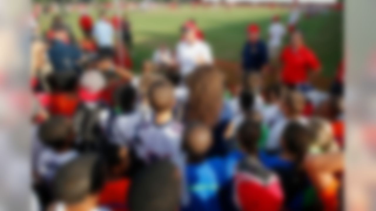 Former Buccaneers tight end Dave Moore talks to youth football players from the Tampa Police Athletic League.