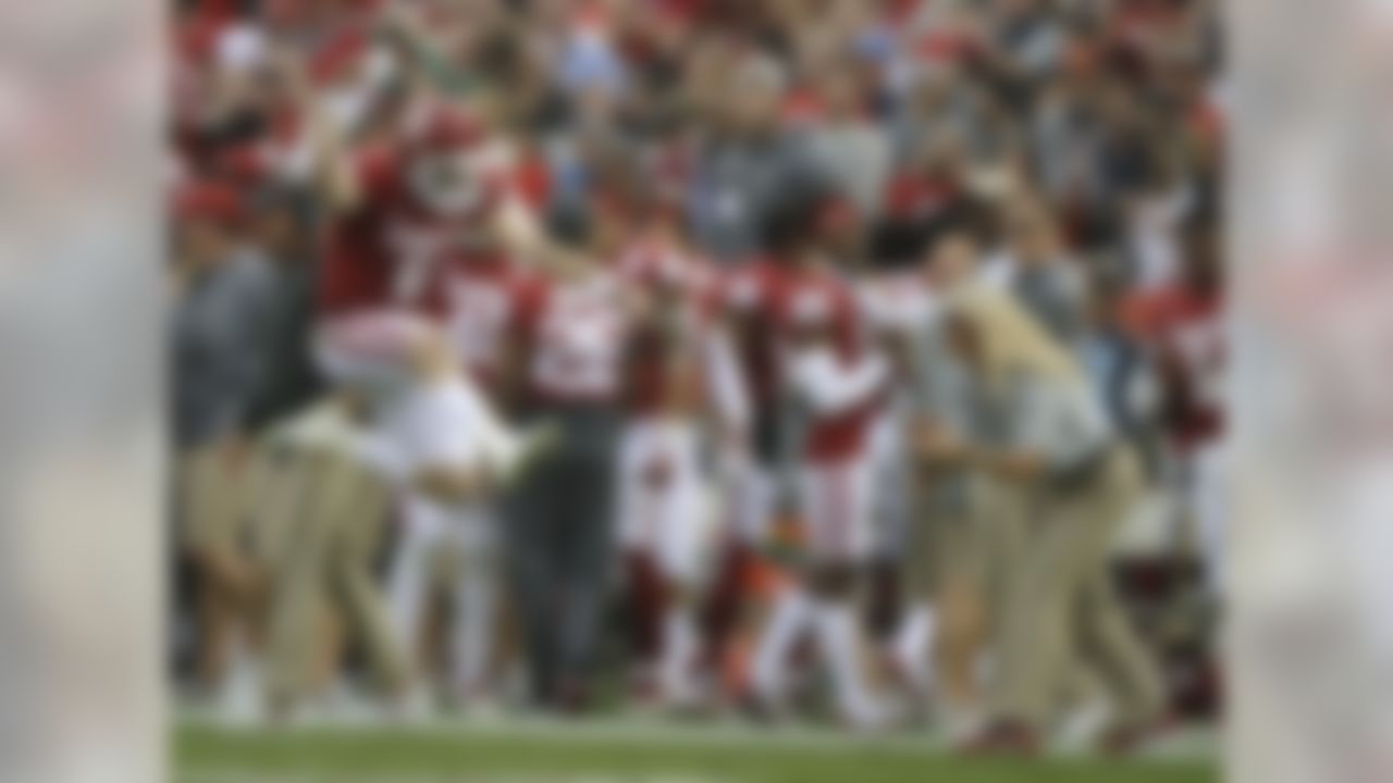 Oklahoma quarterback Baker Mayfield (6) leaps and celebrates after he scored a touchdown against Georgia during the first half of the Rose Bowl NCAA college football game Monday, Jan. 1, 2018, in Pasadena, Calif.