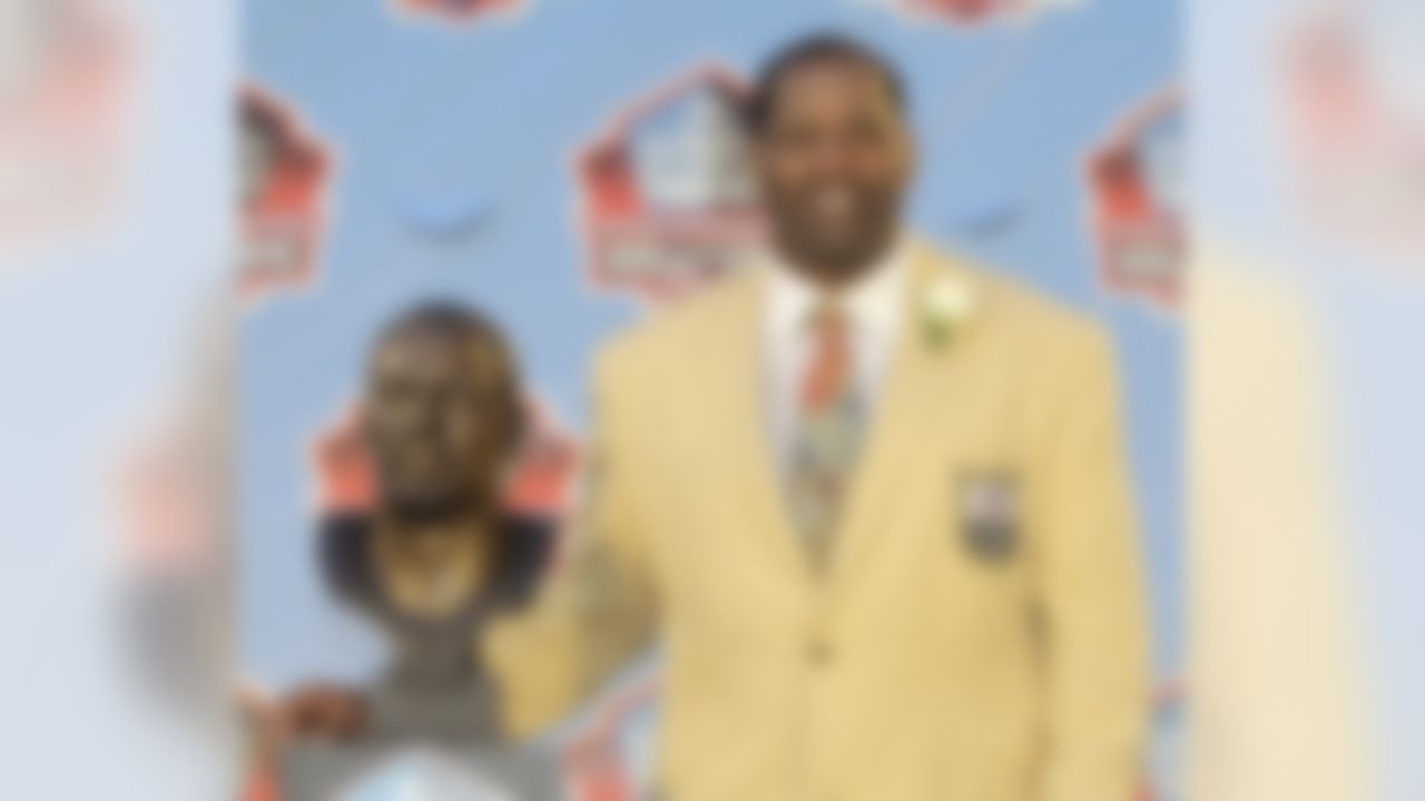 Richard Dent poses with a bust of himself during the induction ceremony at the Pro Football Hall of Fame on Saturday, Aug. 6, 2011, in Canton, Ohio. (AP Photo/Tony Dejak)