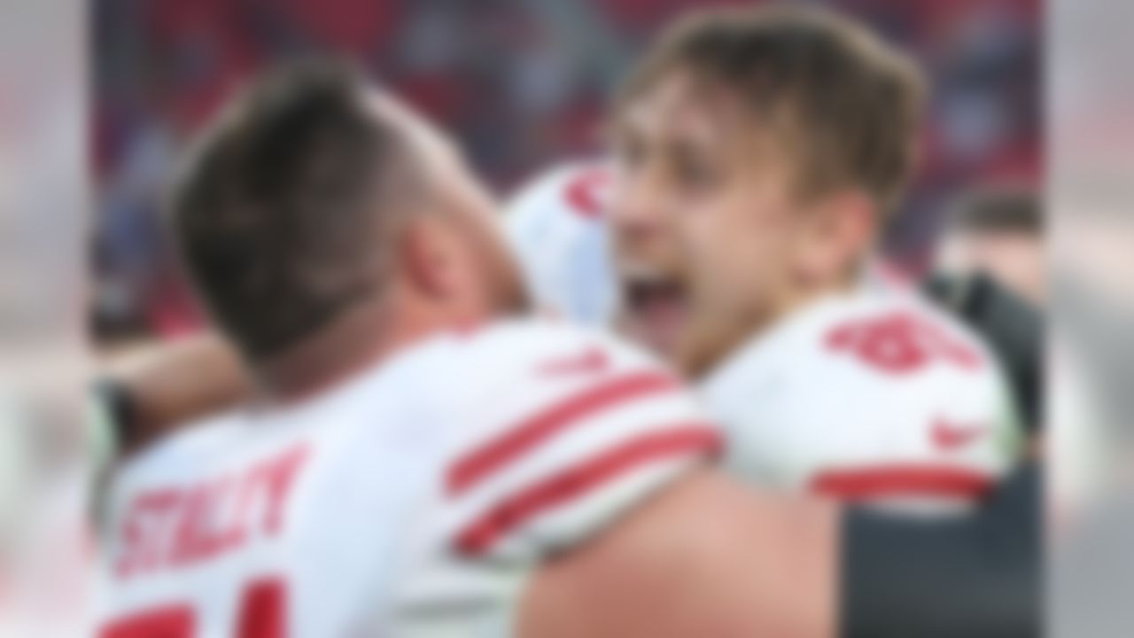 After making a 43-yard touchdown catch, San Francisco 49ers tight end George Kittle (85) celebrates with offensive tackle Joe Staley. Kittle's touchdown catch broke the record for receiving yards in a single season by a tight end.