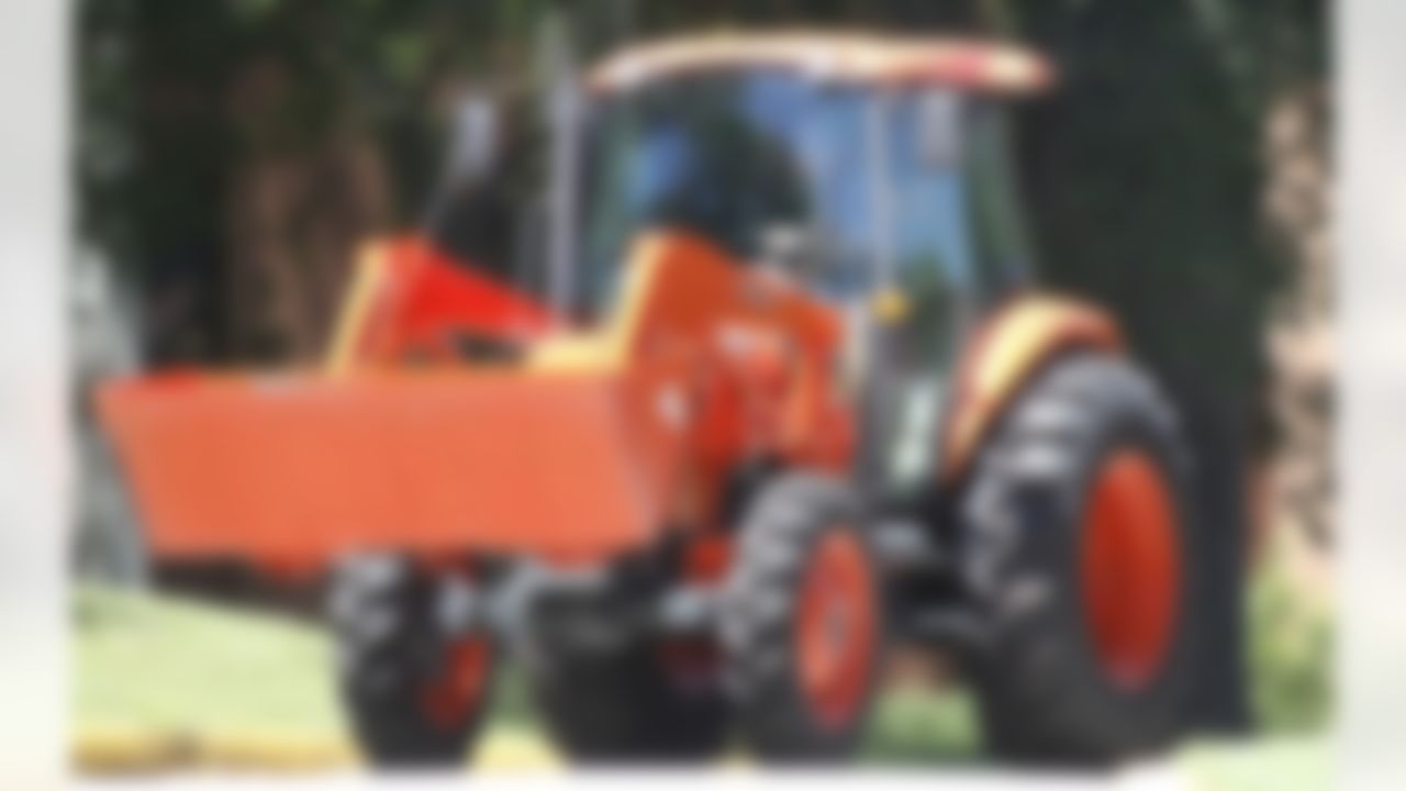 Pittsburgh Steelers defensive lineman Brett Keisel drives a tractor for his arrival at the NFL football team's training camp in Latrobe, Pa., on Wednesday, July 25, 2012. (AP Photo/Keith Srakocic)