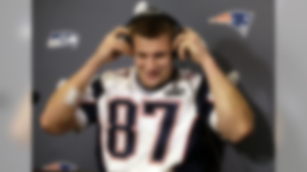 New England Patriots tight end Rob Gronkowski puts on headphones to hear a question during a news conference Thursday, Jan. 29, 2015, in Chandler, Ariz. The Patriots play the Seattle Seahawks in NFL football Super Bowl XLIX Sunday, Feb. 1. (AP Photo/Mark Humphrey)