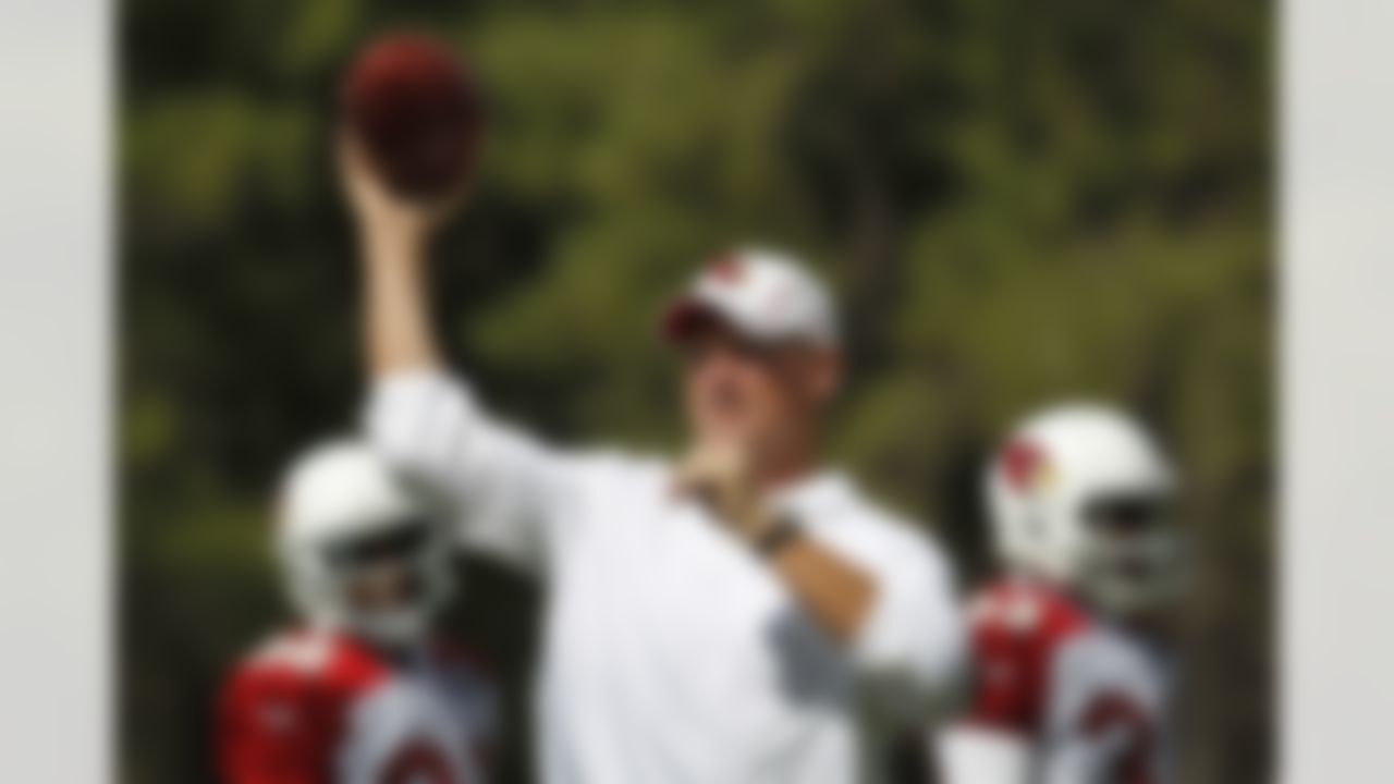 Arizona Cardinals head coach Ken Whisenhunt throws a pass during the first day of NFL training camp football practice at Northern Arizona University, Wednesday, July 25, 2012, in Flagstaff, Ariz. (AP Photo/Ross D. Franklin)