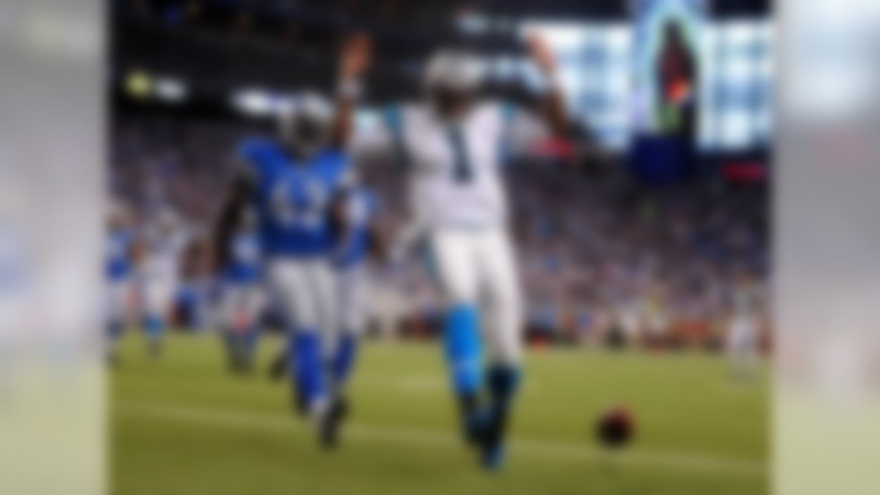 Panthers quarterback Cam Newton runs into the end zone for a touchdown against the Lions.