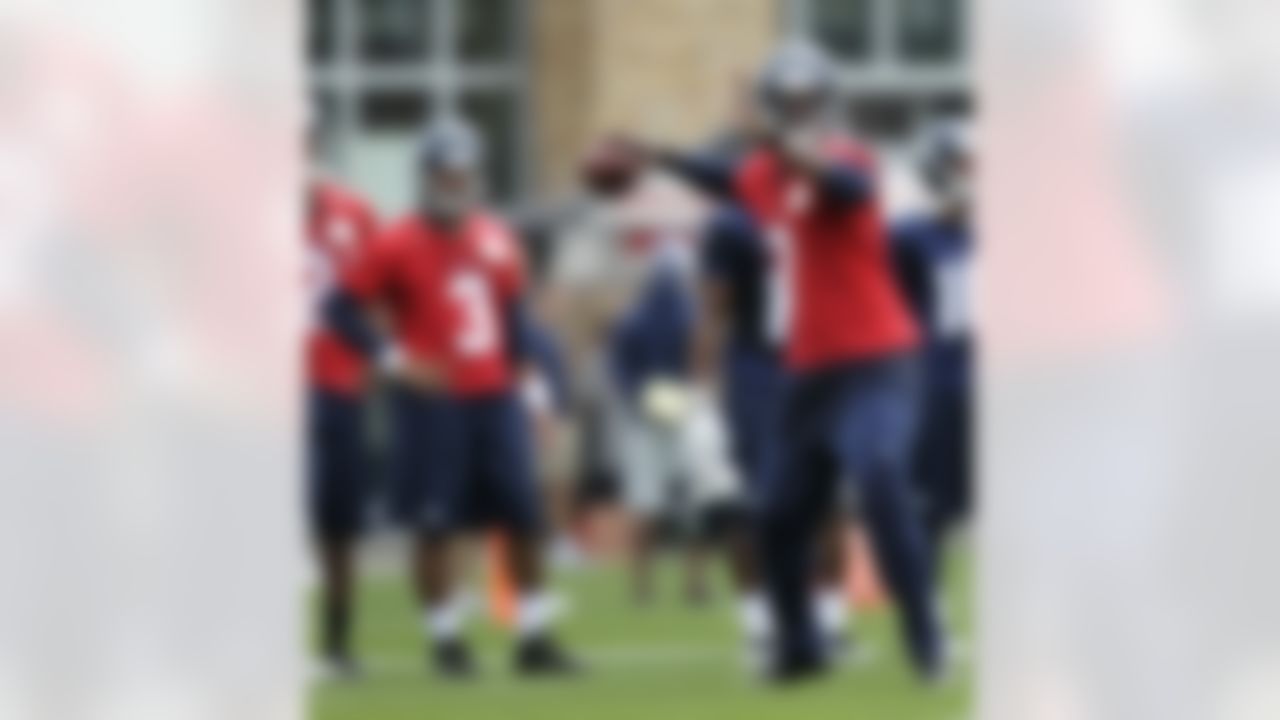 Seattle Seahawks quarterback Russell Wilson, (3) looks on as quarterback Tavaris Jackson, right, passes the ball on Saturday, July 28, 2012, on the first day of NFL football training camp in Ernton, Wash. (AP Photo/Ted S. Warren)