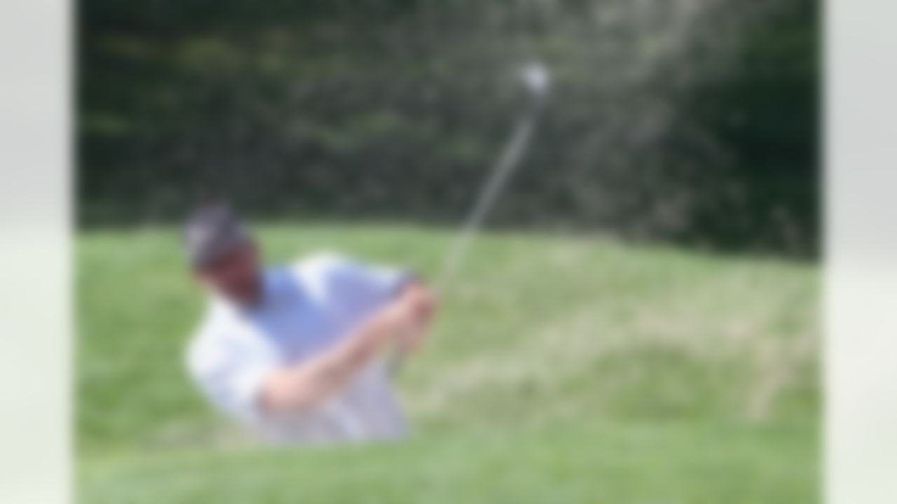 Aaron Rodgers of the Green Bay Packers hits a shot out of the sand during the American Century Championship at Edgewood Tahoe Golf Course in Stateline, Nevada on July 9, 2008. (Ben Liebenberg/NFL)