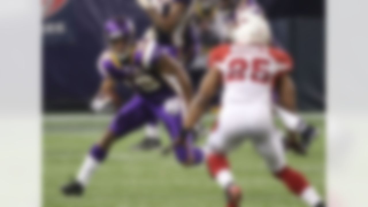 Minnesota Vikings wide receiver Percy Harvin (12) runs against Arizona Cardinals safety Kerry Rhodes (25) in the first quarter of their NFL football game in Minneapolis Sunday, Nov. 7, 2010. (AP Photo/Andy King)