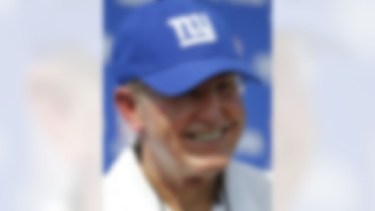 New York Giants head football coach Tom Coughlin answers questions following a physical evaluation drill for his players on opening day of NFL football training camp in Albany, N.Y., Thursday, July 26, 2012. (AP Photo/Kathy Willens)