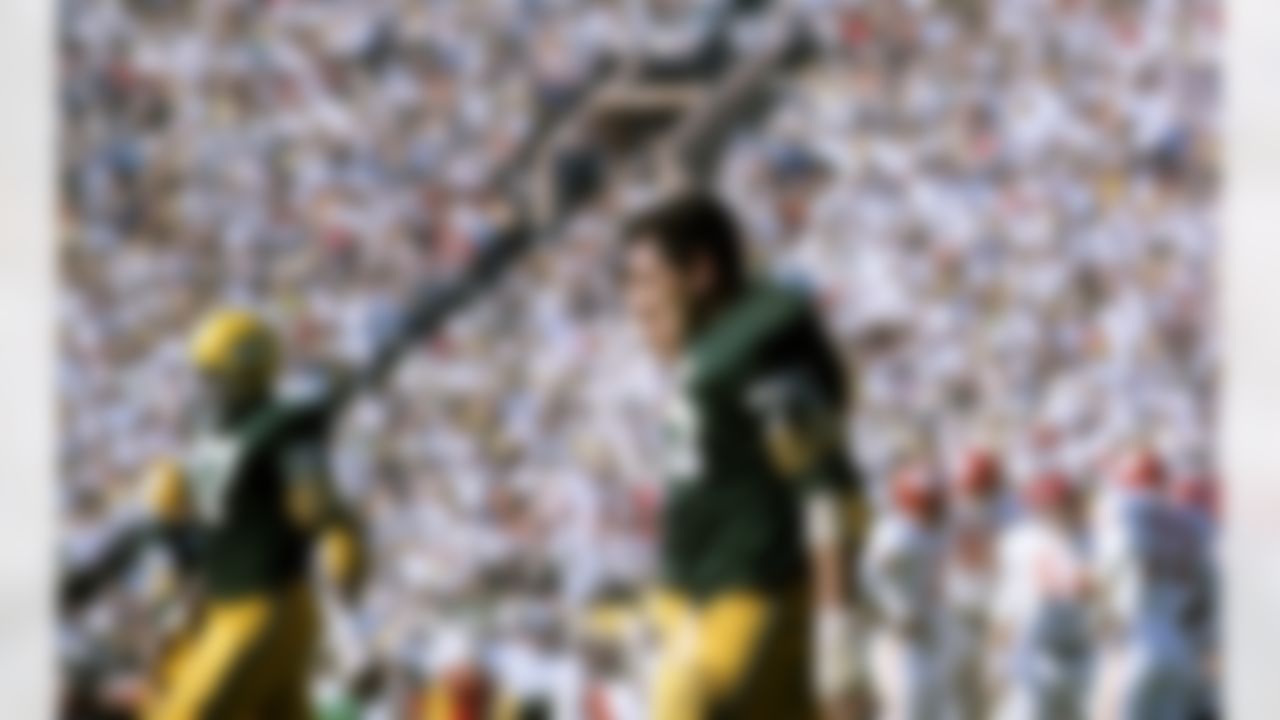 Green Bay Packers defensive end Willie Davis, tackle Forrest Gregg (75)--both Hall of Famers--and guard Jerry Kramer (64) walk off the field during Super Bowl I, a 35-10 victory over the Kansas City Chiefs on January 15, 1967, at the Los Angeles Memorial Coliseum. (National Football League)