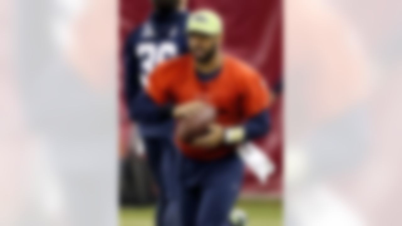 Seattle Seahawks quarterback Russell Wilson (3) runs drills during a team practice for NFL Super Bowl XLIX football game, Friday, Jan. 30, 2015, in Tempe, Ariz. The Seahawks play the New England Patriots in Super Bowl XLIX on Sunday, Feb. 1, 2015. (AP Photo/Matt York)