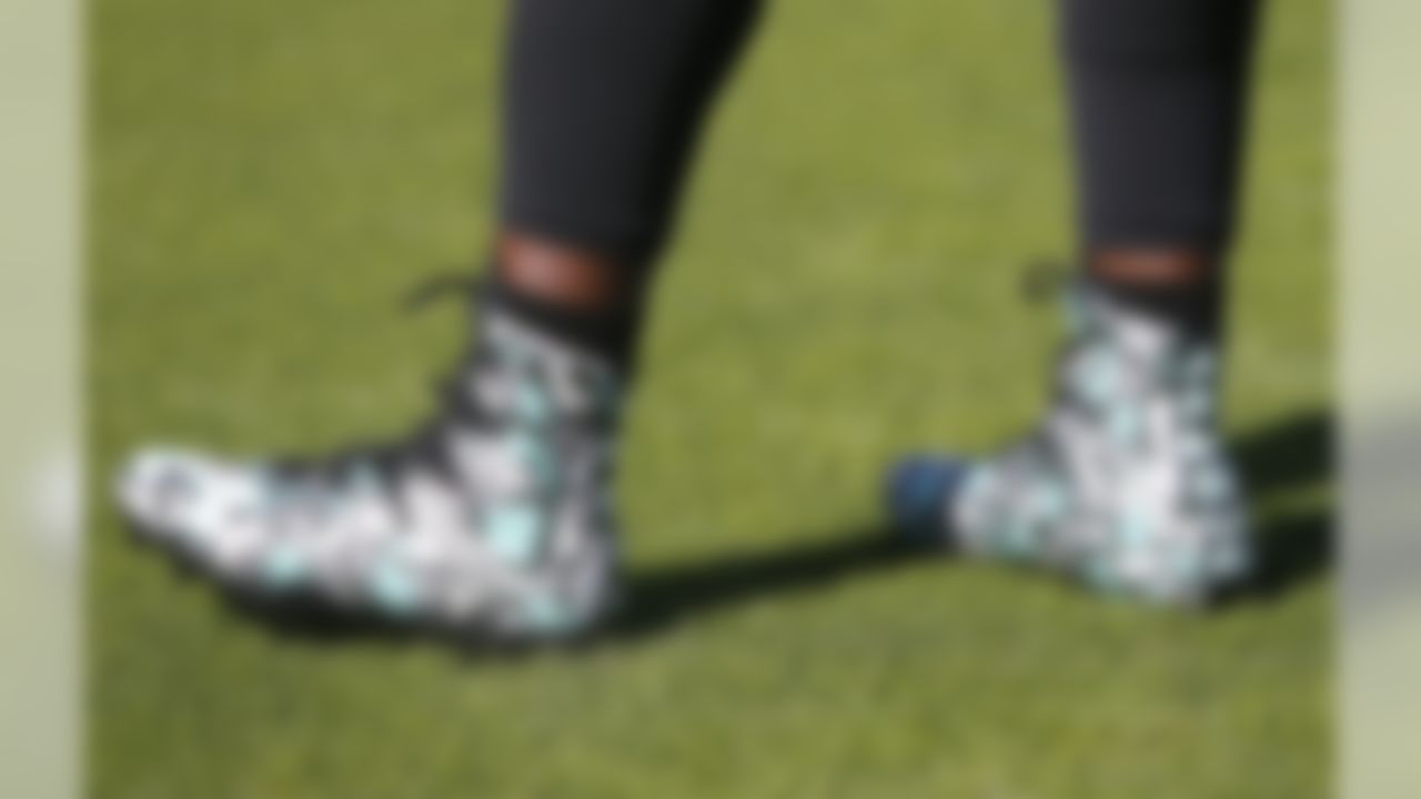 Jacksonville Jaguars running back Leonard Fournette's cleats are seen during warmups before an NFL football game against the Los Angeles Chargers, Sunday, Nov. 12, 2017, in Jacksonville, Fla.