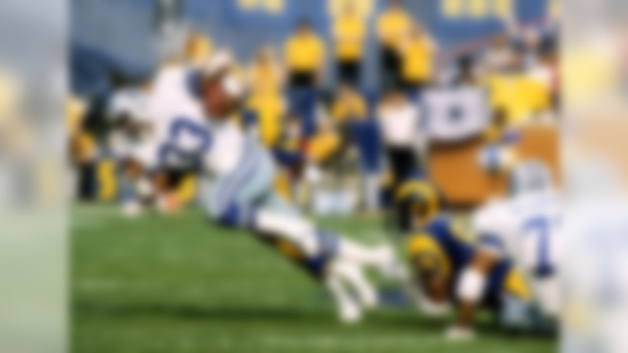 Hall of Fame running back Tony Dorsett (33) of the Dallas Cowboys carries the football before being stopped during the Cowboys 20-0 loss to the Los Angeles Rams in the 1985 NFC Divisional Playoff Game on January 4, 1986 at Anaheim Stadium in Anaheim, California. (National Football League)