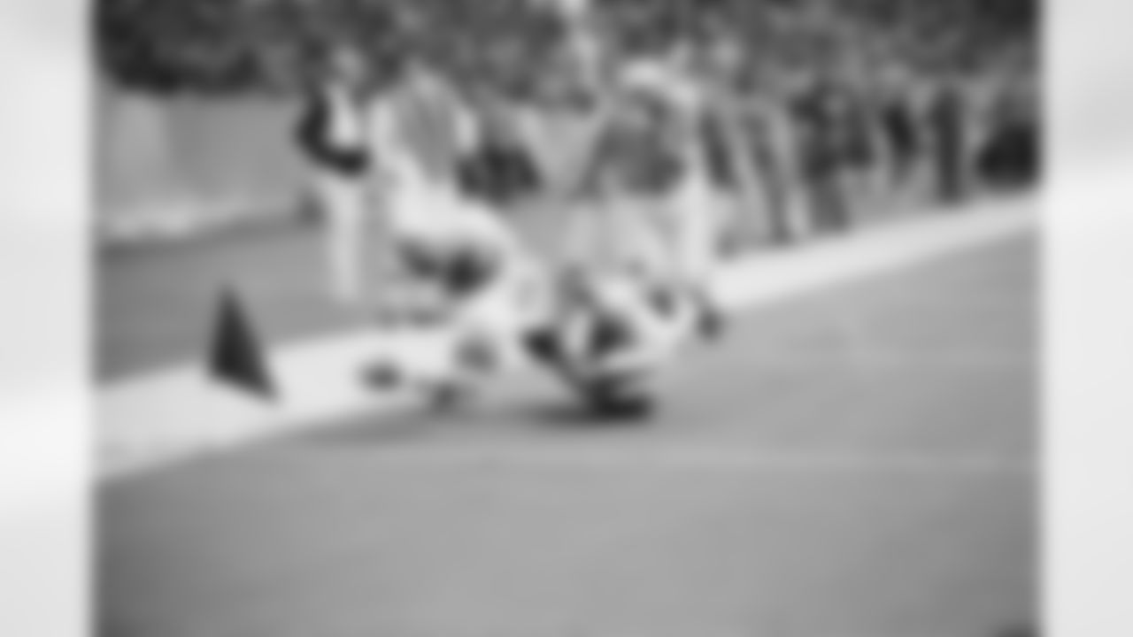 O.J. Simpson, of Buffalo, AFC running back, heads for the side of the field and goal line dragging Jim Johnson of San Francisco, for a touchdown in the second quarter of the Pro Bowl game in Irving, Texas on Jan. 21, 1973. (Associated Press)