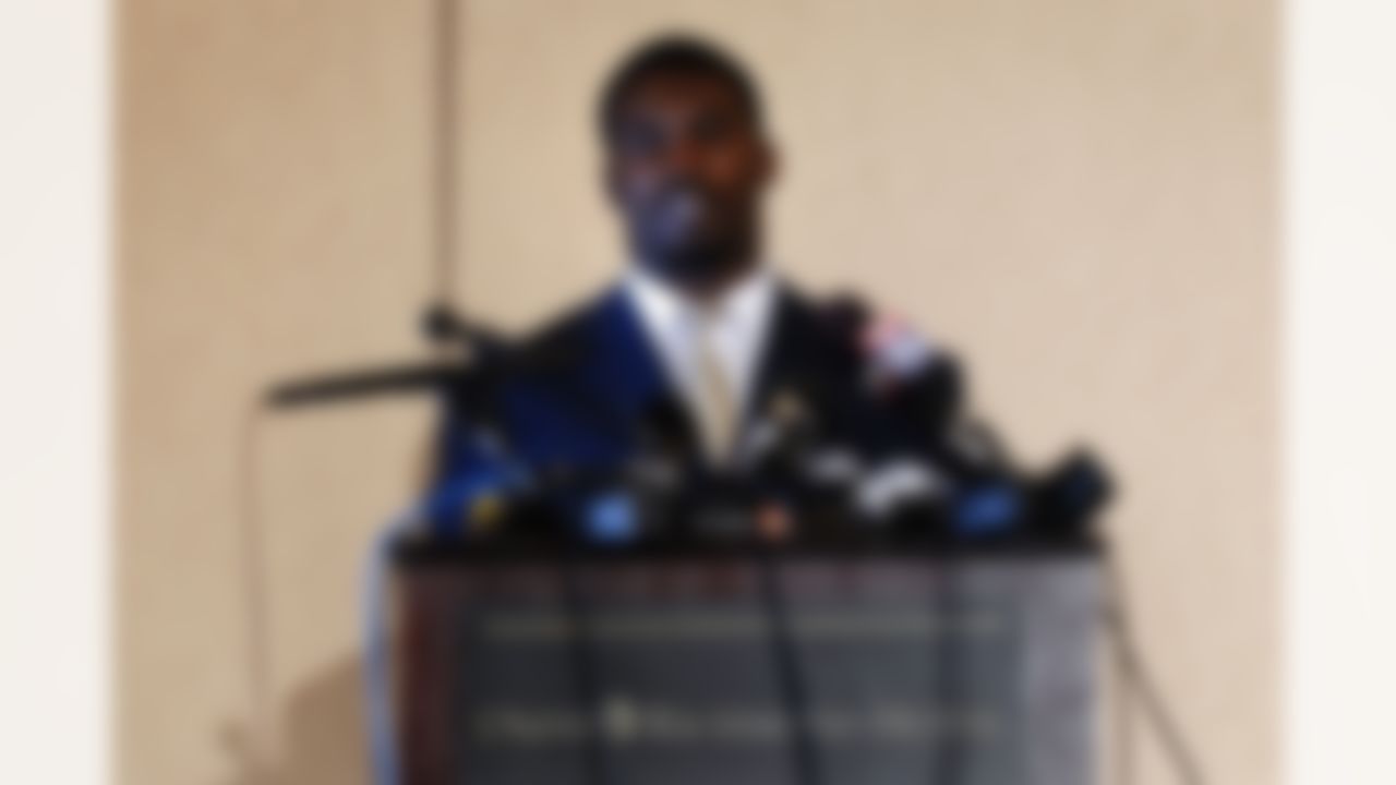 RICHMOND, VA - AUGUST 27: Atlanta Falcons quarterback Michael Vick speaks to reporters at the Omni Richmond Hotel after agreeing to a guilty plea on charges stemming from his involvement in a dogfighting ring August 27, 2007, in Richmond, Virginia. (Photo by Jonathan Ernst/Getty Images)