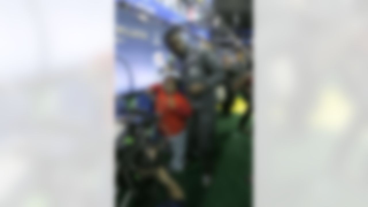 Internet sensation Lil Terio poses for a photograph with Seattle Seahawks defensive end Benson Mayowa (95) during the Super Bowl XLVIII Media Day at the Prudential Center on Tuesday, January 28, 2014 in Newark, NJ. (Perry Knotts/NFL)