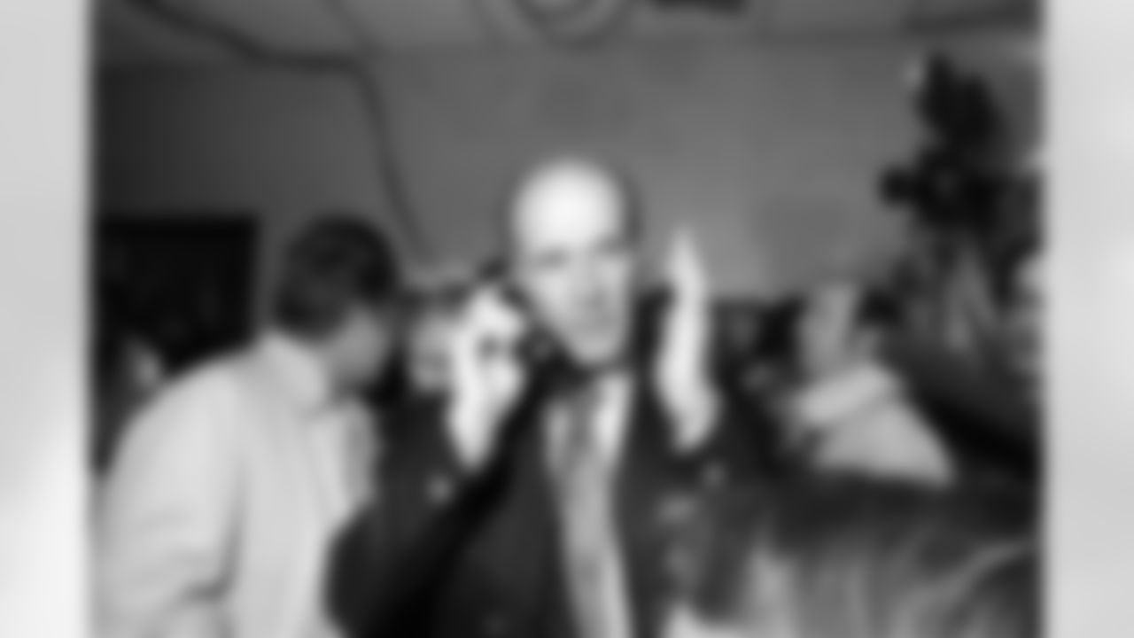 Dallas coach Tom Landry talks with President Nixon on the telephone after the Cowboys 24-3 Super Bowl victory over the Miami Dolphins Jan. 17, 1972 in New Orleans, La. After Landry hung up he discussed the call with newsmen in the dressing room. (Associated Press)