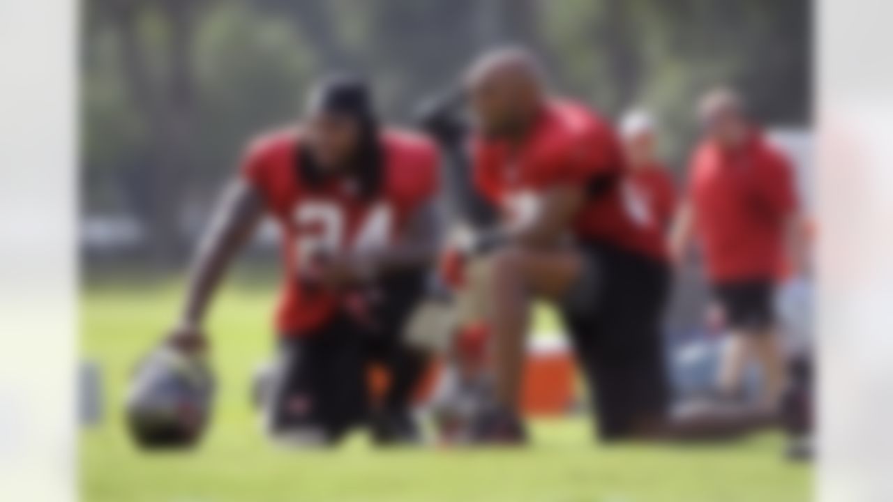 Tampa Bay Buccaneers safety Mark Barron, left, and defensive back Ronde Barber watch workouts together from the sidelines during NFL football training camp, Friday, July 27, 2012, in Tampa, Fla. (AP Photo/Brian Blanco)