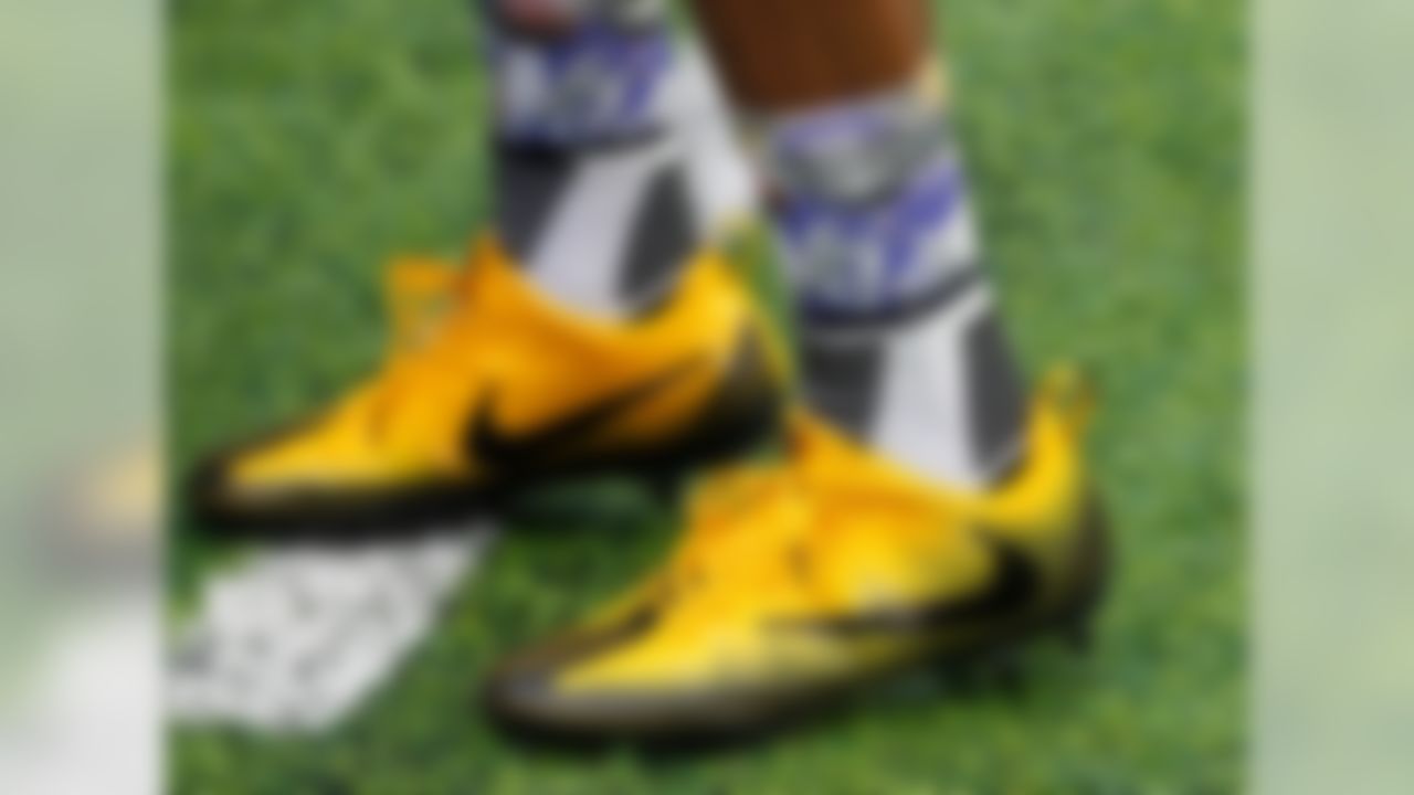 Though Patterson did not end up wearing these in the actual game, it is still hilarious to warm-up while wearing socks with your own face on them.