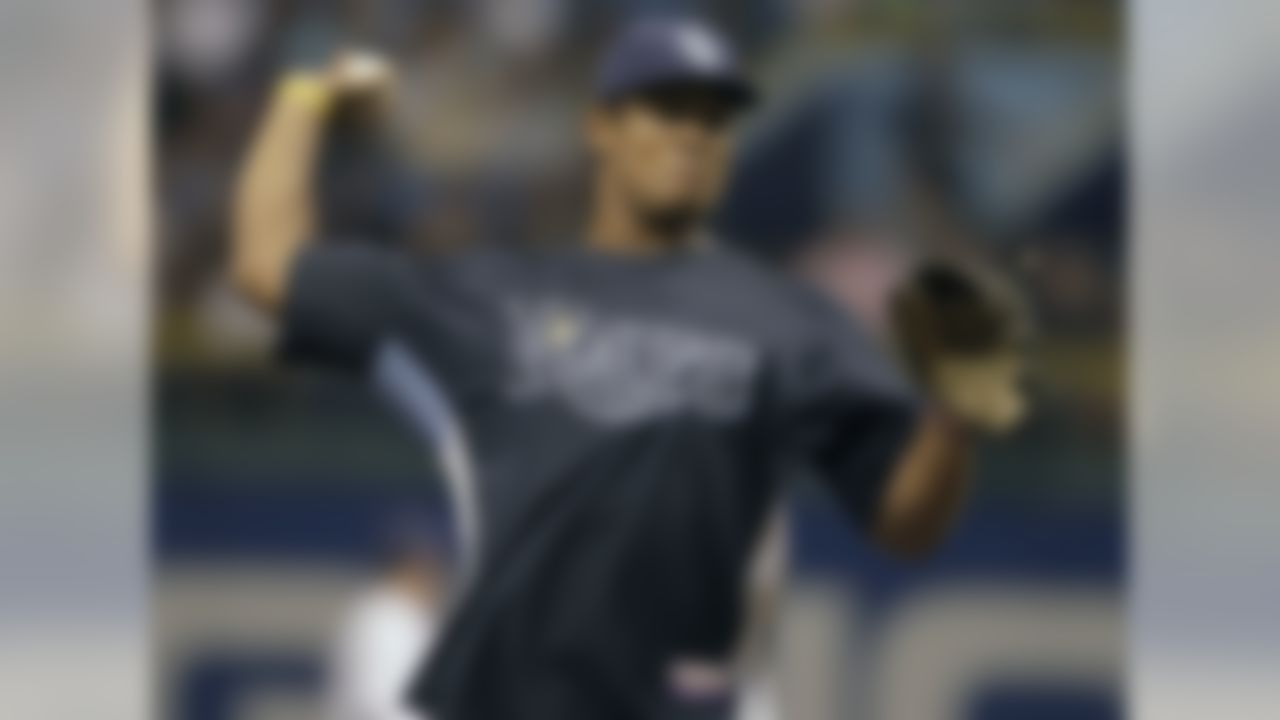 Tampa Bay Buccaneers quarterback Josh Freeman throws out the ceremonial first pitch before a baseball game between the Boston Red Sox and Tampa Bay Rays Monday, May 24, 2010 in St. Petersburg, Fla. (AP Photo/Chris O'Meara)