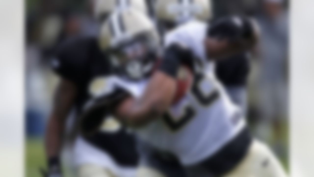 New Orleans Saints running back Mark Ingram (28) carries the ball during training camp at their NFL football training facility in Metairie, La., Saturday, July 28, 2012. (AP Photo/Gerald Herbert)