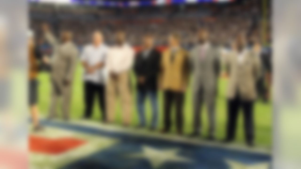 Members of the Pro Football Hall of Fame Class of 2010 (left to right) linebacker Rickey Jackson, guard Russ Grimm, defensive tackle John Randle, running back Floyd Little, cornerback Dick LeBeau, wide receiver Jerry Rice, and running back Emmitt Smith pose for a photo on the field at the Indianapolis Colts game against the New Orleans Saints in Super Bowl XLIV, February 7, 2010 in Miami Gardens, Florida. The Saints won the game 31-17. (AP Photo/Paul Spinelli)