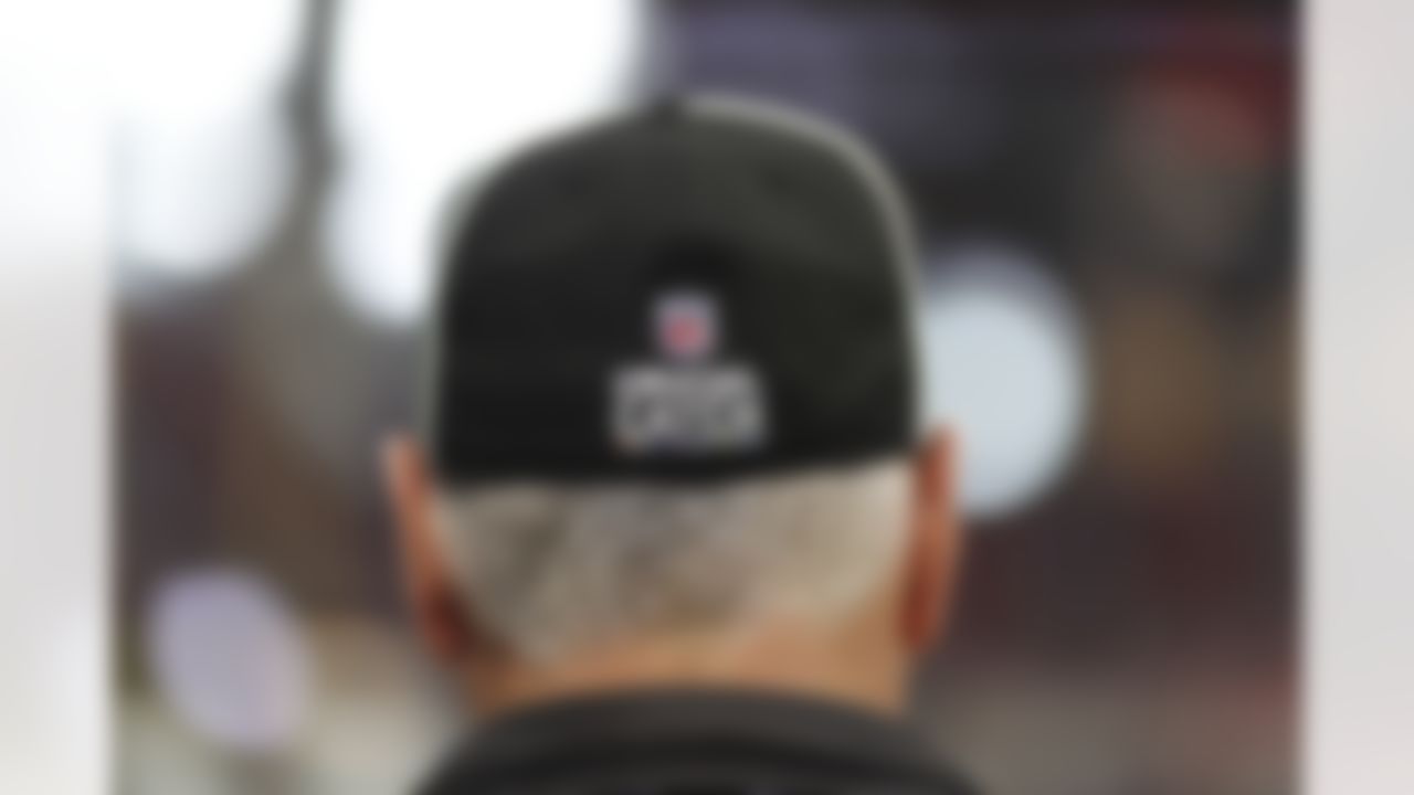 An official wears a cap with Crucial Catch signage for Cancer Awareness during the first half of an NFL football game between the Atlanta Falcons and the Miami Dolphins, Sunday, Oct. 15, 2017, in Atlanta.