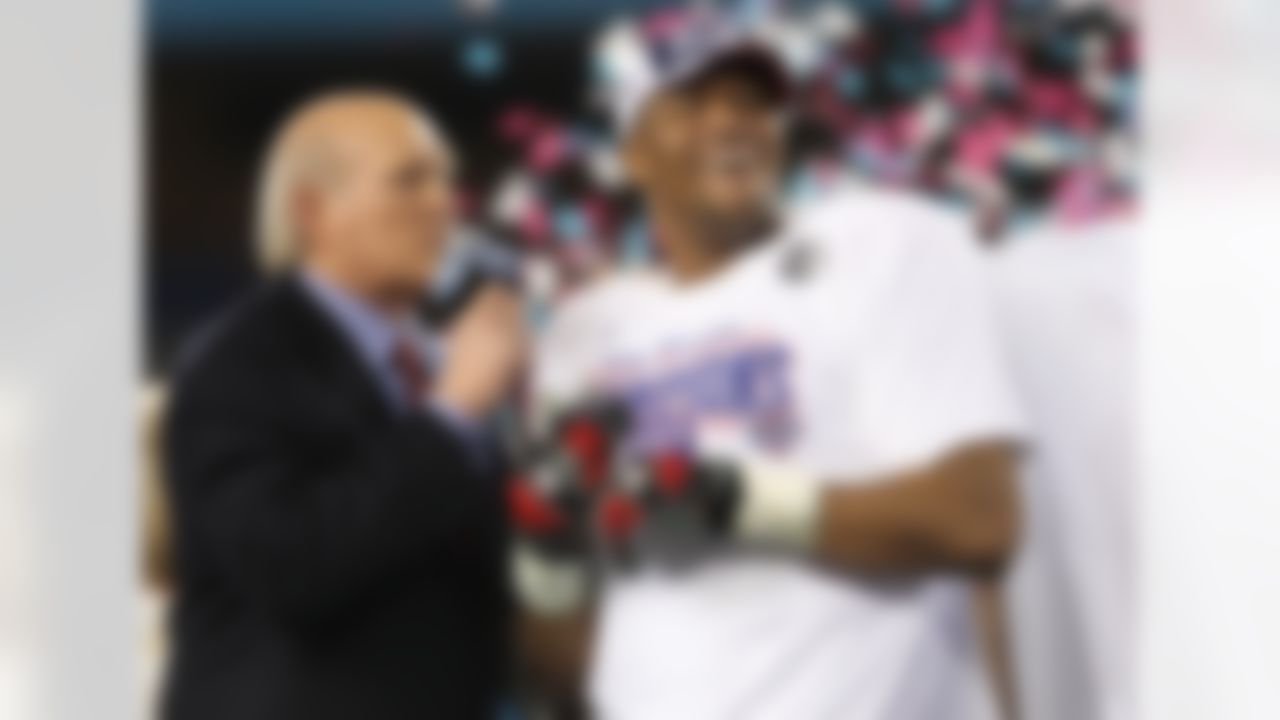Michael Strahan #92 of the New York Giants is interviewed by Terry Bradshaw after the Giants defeated the New England Patriots 17-14 during Super Bowl XLII on February 3, 2008 at the University of Phoenix Stadium in Glendale, Arizona. (Ben Liebenberg/NFL)
