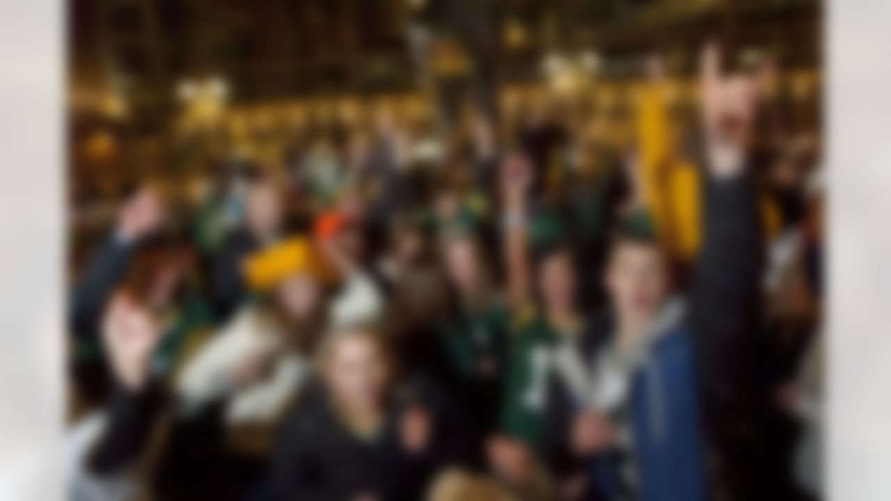 Green Bay Packers fans celebrate Sunday, Feb. 6, 2011, near the atrium of Lambeau Field in Green Bay, Wis. after the Packers won Super Bowl XLV. (AP Photo/Mike Roemer)