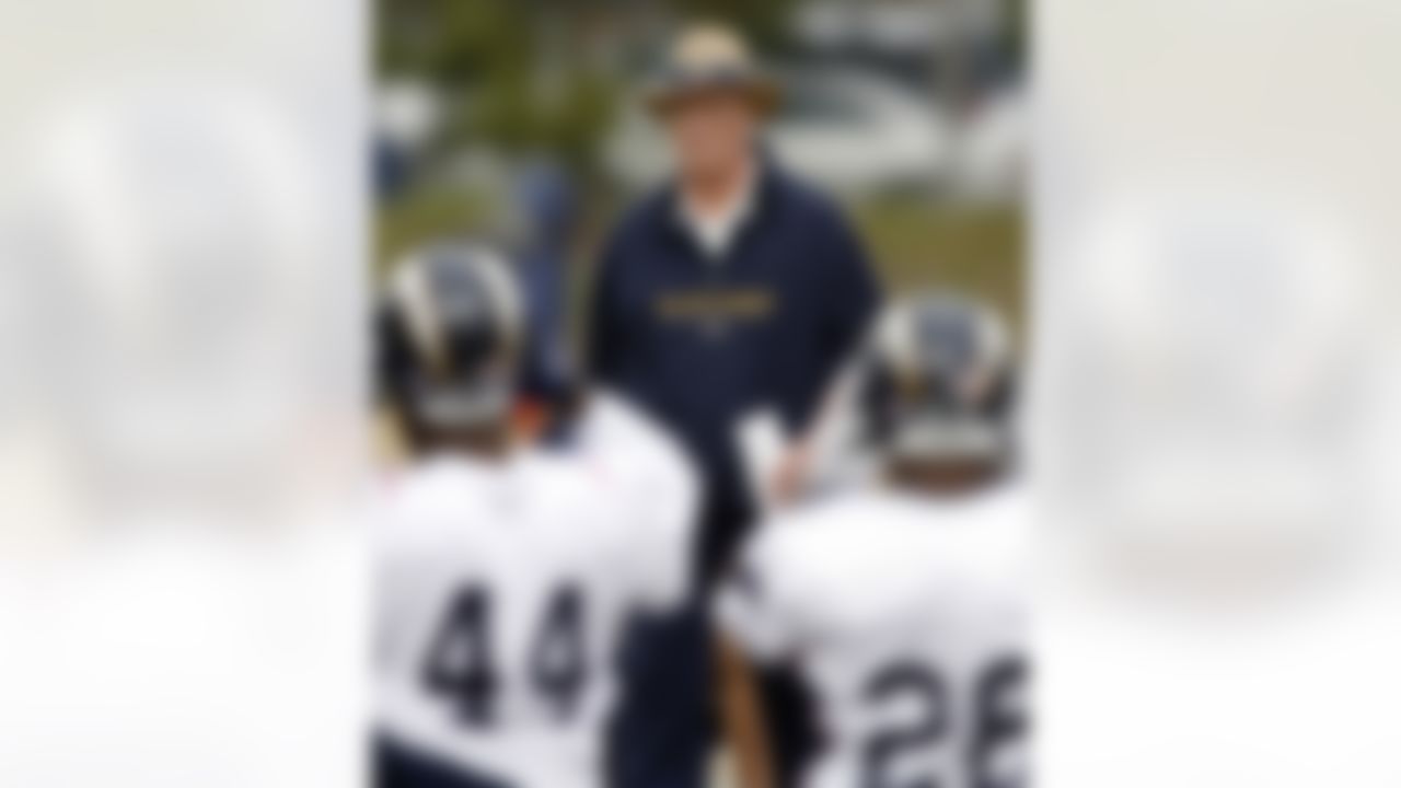 San Diego Chargers then-coach Marty Schottenheimer walks among his players during practice in San Diego. Schottenheimer has been hired as head coach and general manager of the Virginia Destroyers of the UFL. (AP Photo/Denis Poroy, File)