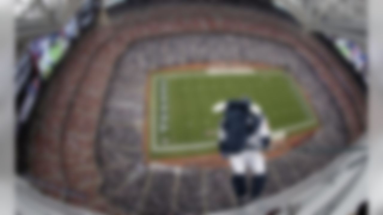 Toro, the Houston Texans mascot, lowers himself into Reliant Stadium to help introduce the team's banner celebrating its AFC South division title in the 2012 season. (AP Photo/David J. Phillip)