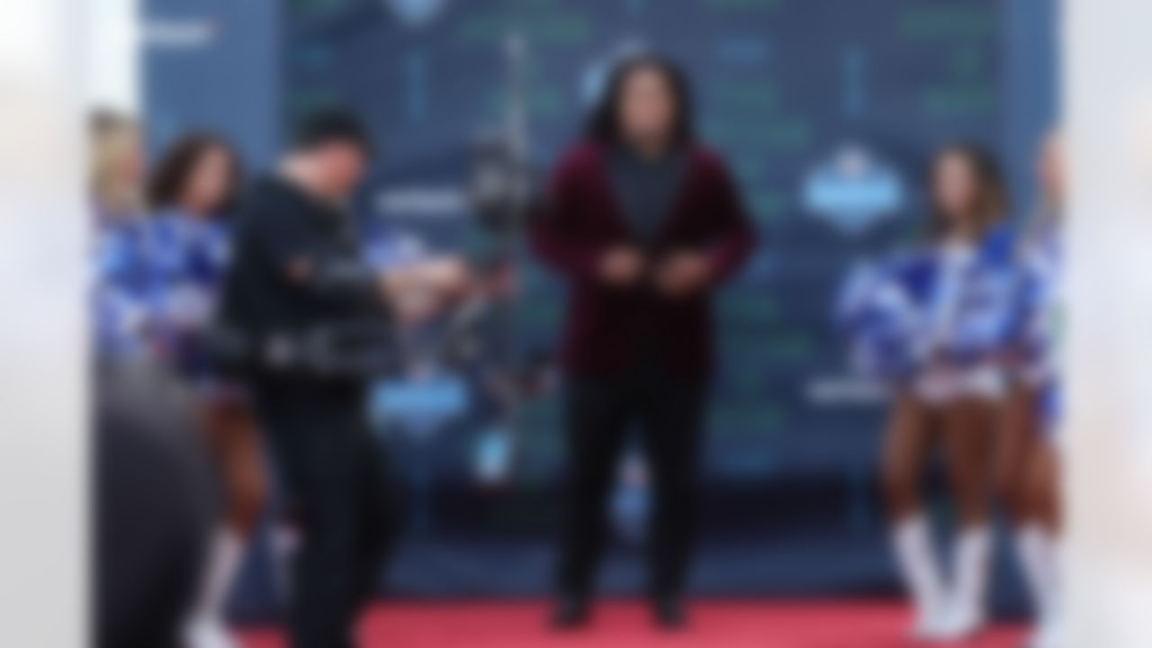 Washington defensive tackle Vita Vea walks down the red carpet.