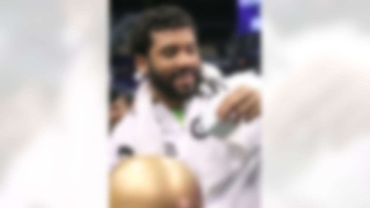 Seattle Seahawks quarterback Russell Wilson answers a question during Media Day for Super Bowl XLIX at the U.S. Airways Center on Tuesday, January 27, 2015 in Phoenix, AZ. (Perry Knotts/NFL)