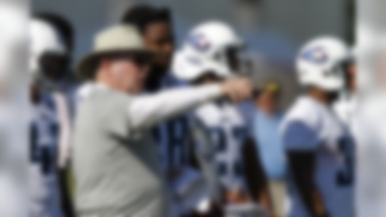 Tennessee Titans offensive coordinator Chris Palmer, front, talks with running back Chris Johnson on during NFL football camp at Titans' headquarters Saturday, July 28, 2012 Nashville, Tenn. (AP Photo/Wade Payne)