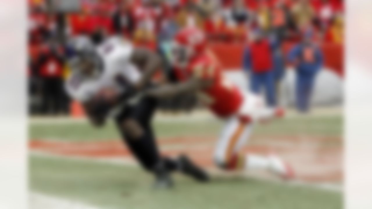 Baltimore Ravens wide receiver Anquan Boldin (81) kicks up some dirt as he catches a third quarter touchdown pass that gives the Ravens a 23-7 lead while covered by Kansas City Chiefs cornerback Brandon Flowers (24) during the NFL 2011 AFC Wild Card playoff football game against the Kansas City Chiefs on Sunday, January 9, 2011 in Kansas City, Missouri. The Ravens won the game 30-7. (AP Photo/Paul Spinelli)
