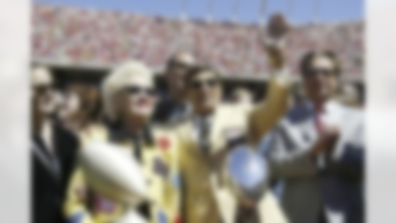 Former head coach Hank Stram of the Kansas City Chiefs waves to the crowd after receiving his hall of fame ring during halftime of a 41 to 20 Chiefs win over the Pittsburgh Steelers at Arrowhead Stadium in Kansas City, Missouri on September 14, 2003. (AP Photo/G. Newman Lowrance)