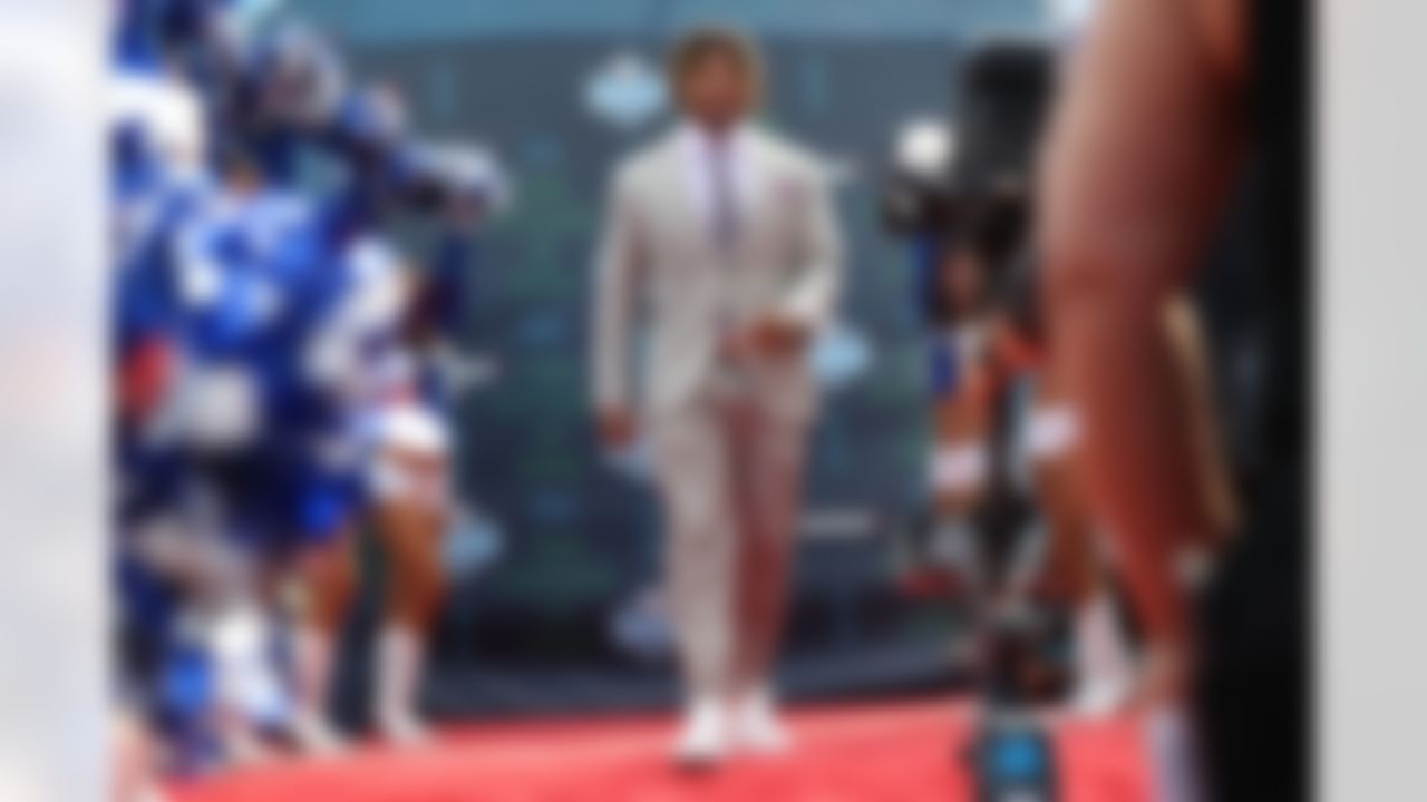 LSU running back Derrius Guice walks down the red carpet.